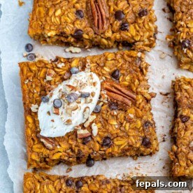 pumpkin baked oatmeal squares on a parchment paper