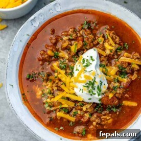 top view of beef chili in white bowl