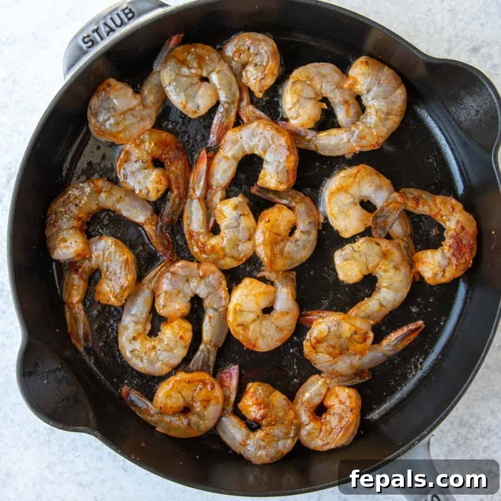 Golden Honey Mustard Shrimp and Crispy Potatoes 8 raw shrimp in skillet before cooking