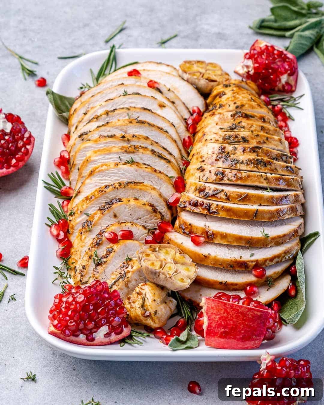 Tender Maple Glazed Boneless Turkey Breast 9 White platter with two roasted turkey breast sliced.