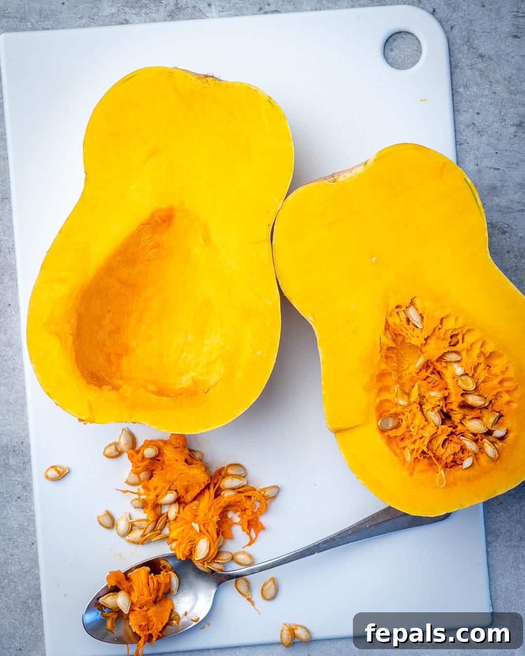 Golden Roasted Butternut 5 A visual comparison of a halved butternut squash with seeds and another half with seeds removed, demonstrating prep stages.