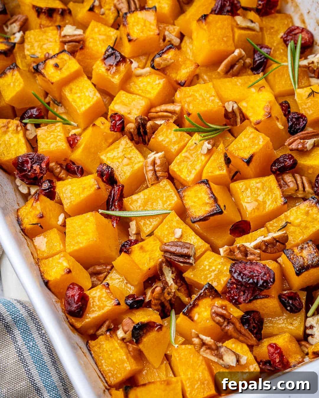 Maple Caramelized Butternut 8 Close-up view of perfectly caramelized maple roasted butternut squash cubes, showing the glossy, golden-brown texture.