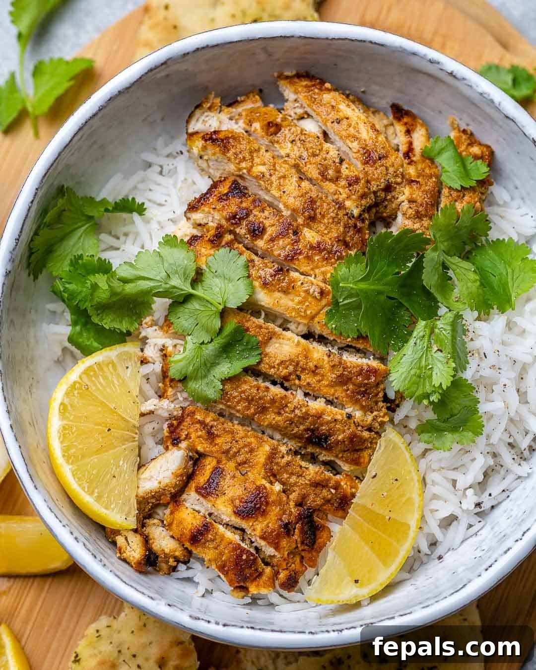 Flavorful Tandoori Chicken Made Easy 2 top view of sliced tandoori chicken over white rice