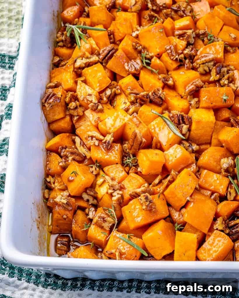 A baking dish with maple pecan roasted sweet potatoes. 