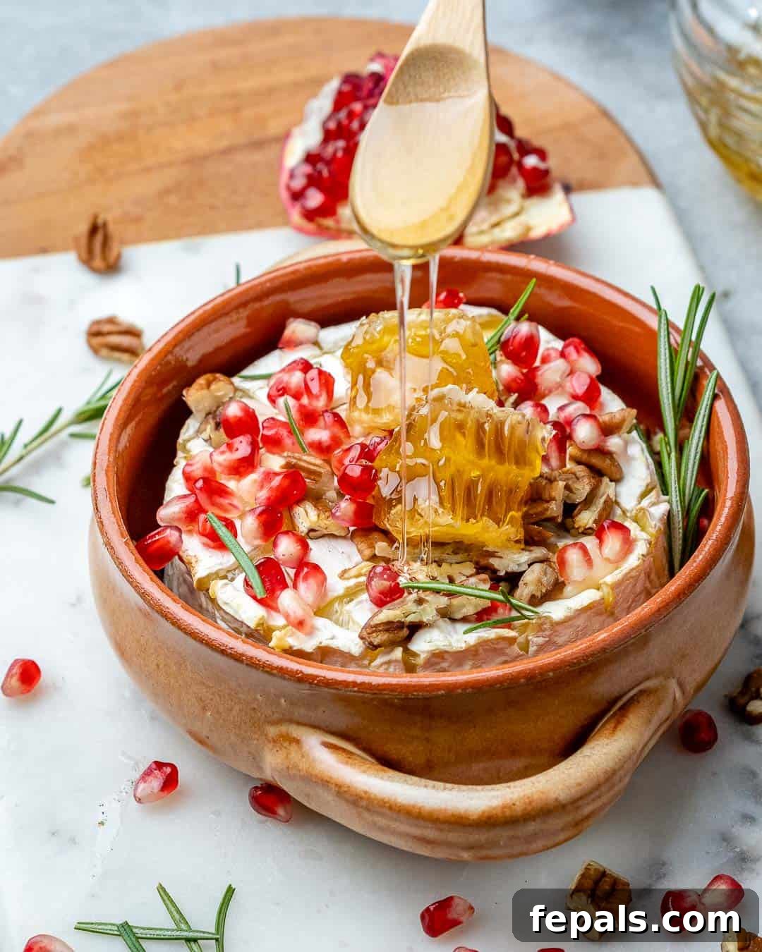Warm Brie with Jewels of Pomegranate 8 Drizzling honey on baked brie cheese with pomegranates and pecans