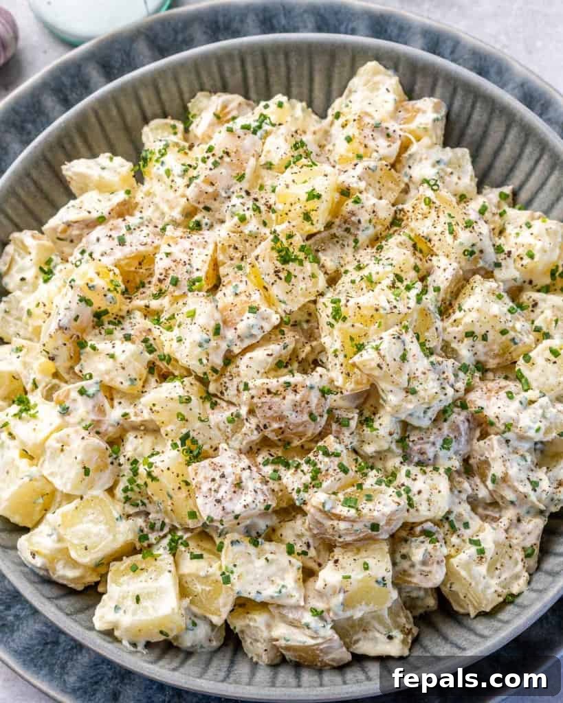 Simple Zesty Mustard Potato Salad 10 Top view of the healthy mustard potato salad served in a gray plate, highlighting its appetizing presentation.
