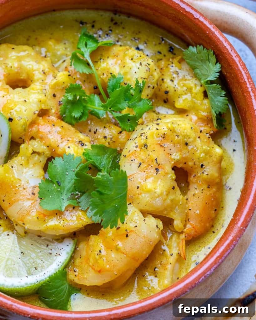 Creamy Coconut Green Curry with Shrimp 3 close up shrimp curry in an orange bowl