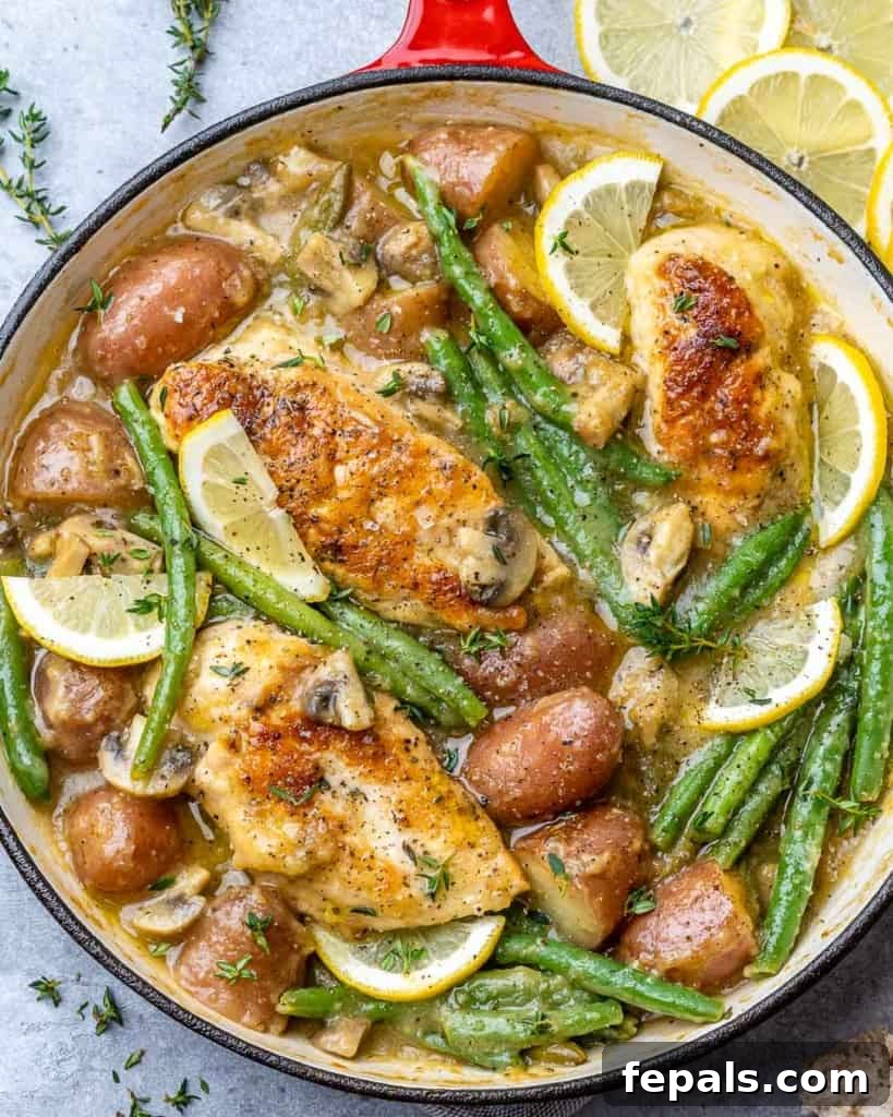 top view chicken breast with green beans and potatoes in a skillet