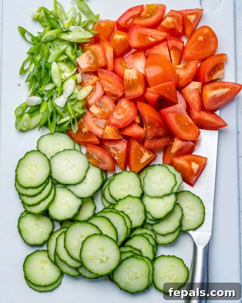 Vibrant Mediterranean Chopped Salad 6 chopped tomatoes, cucumber, and onions on platter