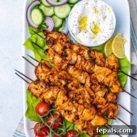 top view chicken shish tawook skewers on a long white dish