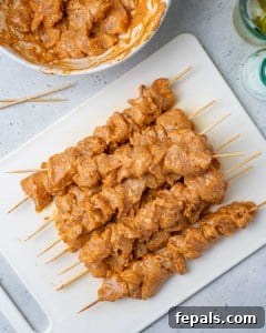 marinated chicken chunks placed on skewers
