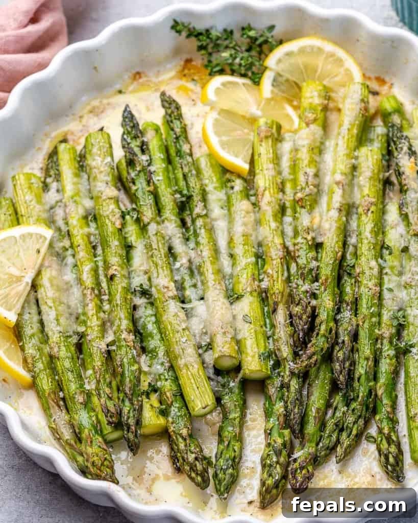 Parmesan Crusted Asparagus 3 side shot of roasted asparagus on a white dish