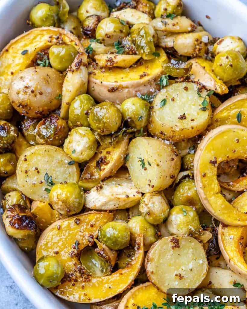 Golden Roasted Vegetables 3 Close-up view of golden-brown roasted vegetables in a white dish, showing their tender texture and flavorful coating.