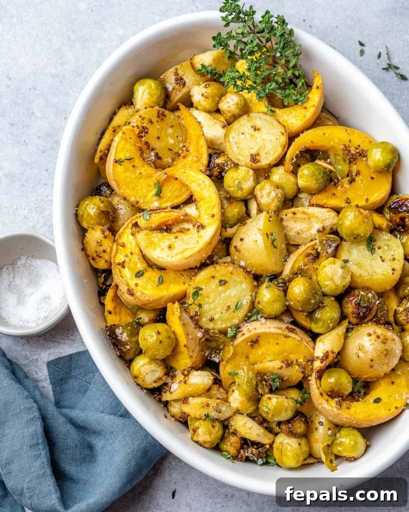 Golden Roasted Vegetables 7 Top-down view of a white dish filled with beautifully roasted vegetables, golden-brown and ready to serve.