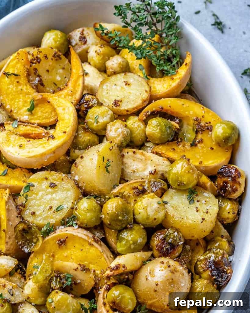 Golden Roasted Vegetables 9 A bowl of roasted vegetables with a hint of fresh herbs, ready to be served.