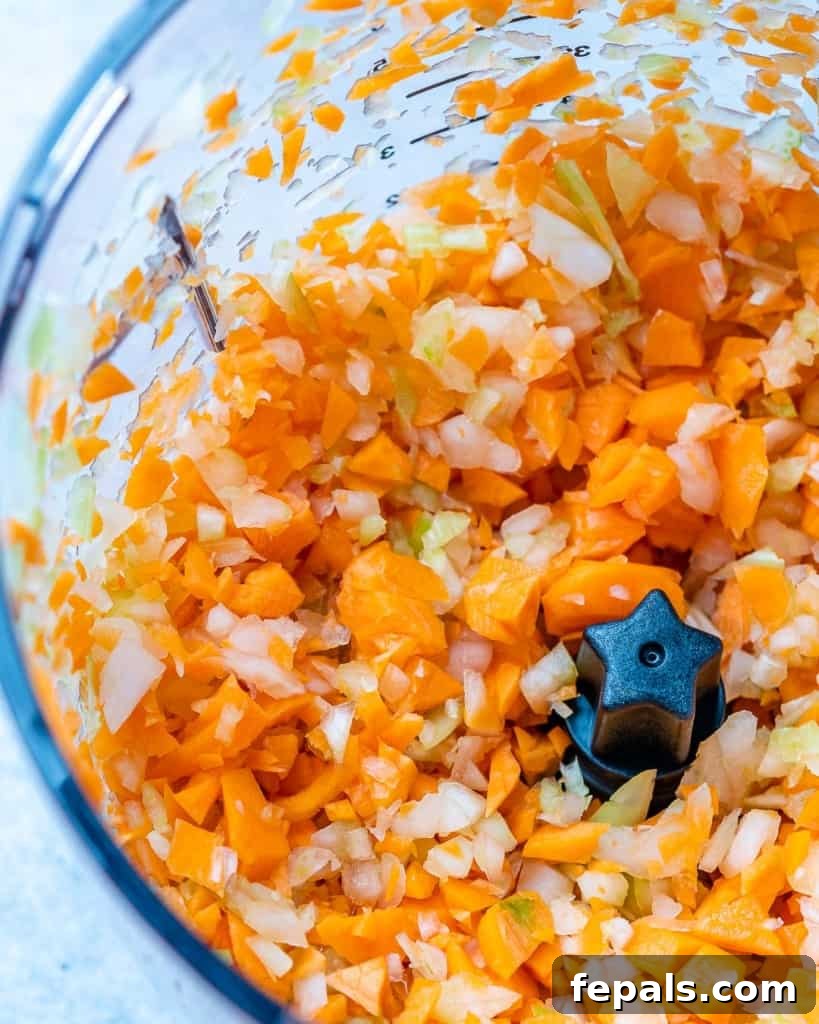 Hearty Beef Bolognese 5 Vegetables chopped in a food processor.
