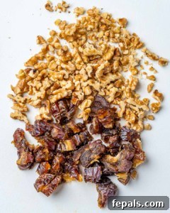 chopped walnuts and dates on a cutting board