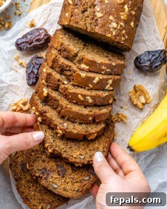 slices of banana bread with hand holding a slice