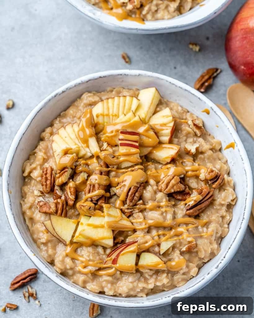 Nutty Oatmeal Morning Fuel 9 A beautifully presented bowl of peanut butter and banana oatmeal, garnished with nuts and seeds.