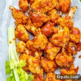Top view of buffalo cauliflower bites on a white dish.