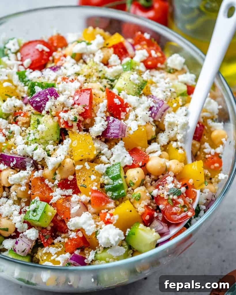Vibrant Chickpea Quinoa Salad 3 side shot quinoa veggie salad in a clear bowl