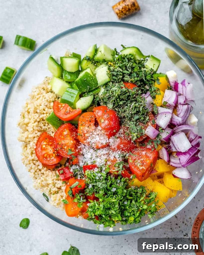 Vibrant Chickpea Quinoa Salad 6 prepped salad ingredients in a bowl before tossing them together
