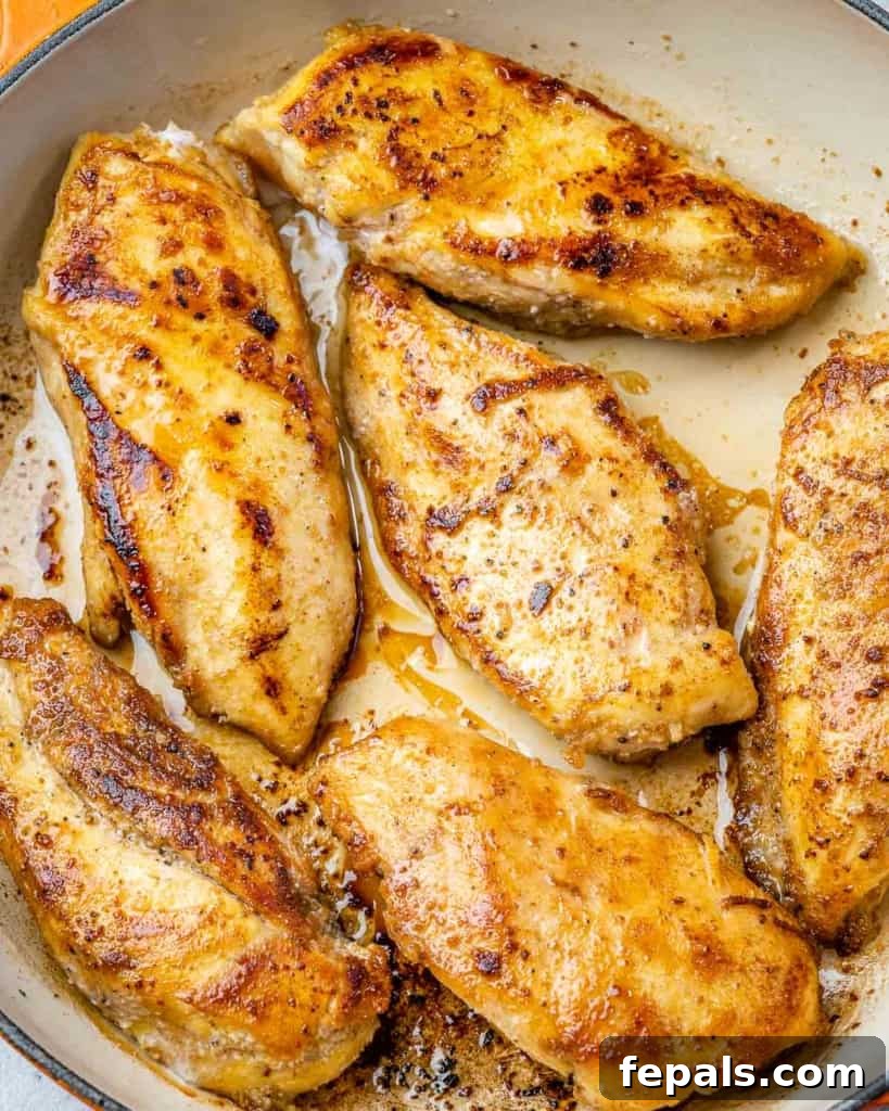 Tropical Coconut Chicken Feast 5 pan seared coconut chicken breast in a skillet