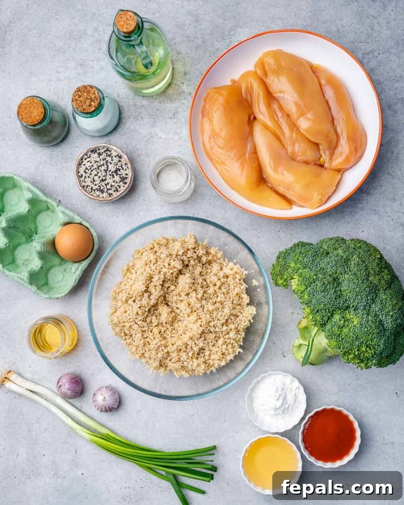 A collection of fresh ingredients laid out on a table, including chicken breast, broccoli, honey, garlic, and sriracha, ready to make honey garlic chicken.