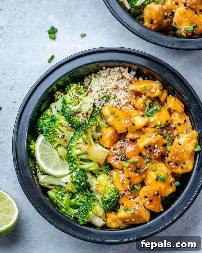 A bowl filled with succulent chicken bites, crisp broccoli, and fluffy quinoa, perfectly portioned for a healthy meal.