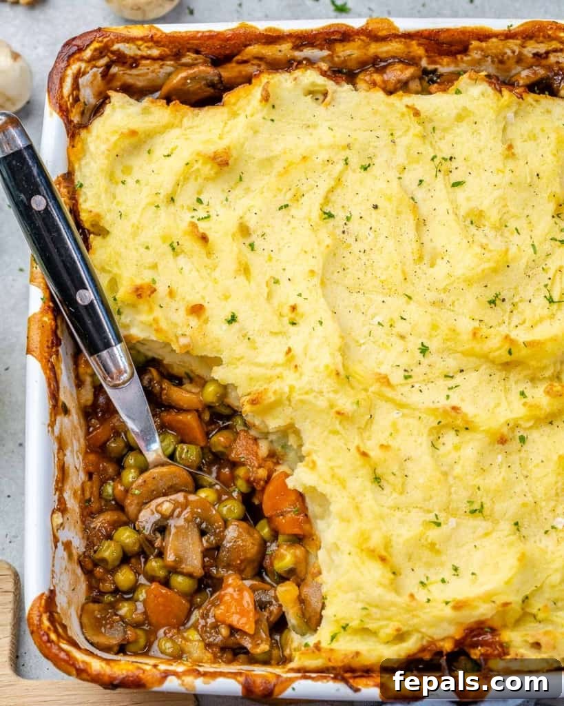 Garden Shepherd's Pie 8 A side shot of vegetarian shepherd's pie, showcasing the layers of fluffy mashed potatoes and hearty vegetable filling.