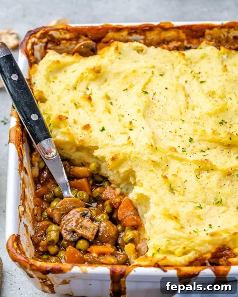 Garden Shepherd's Pie 10 A beautiful side shot of vegetarian shepherd's pie in a serving dish, highlighting its comforting presentation.