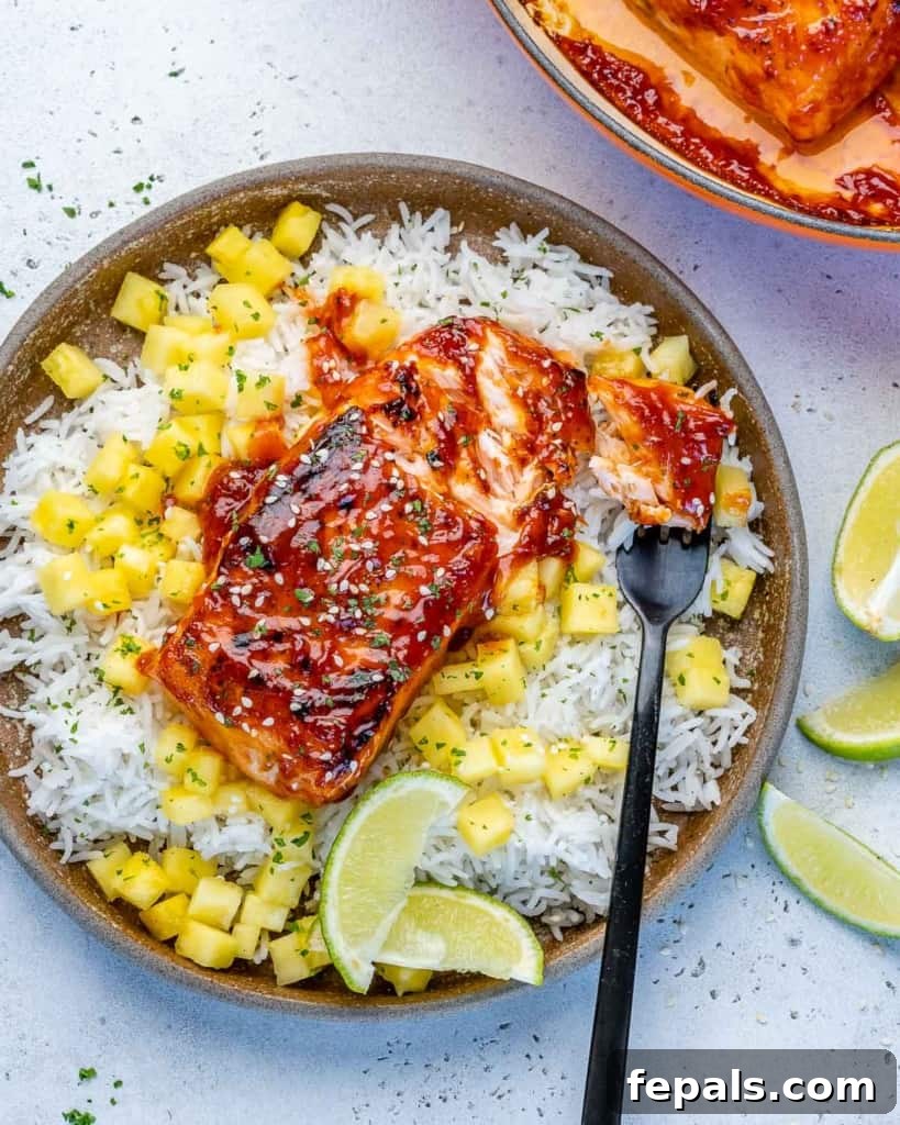 Fire-Kissed Salmon 9 Top view of a single serving bowl filled with BBQ salmon, rice, and pineapple chunks, perfectly arranged and ready to eat.
