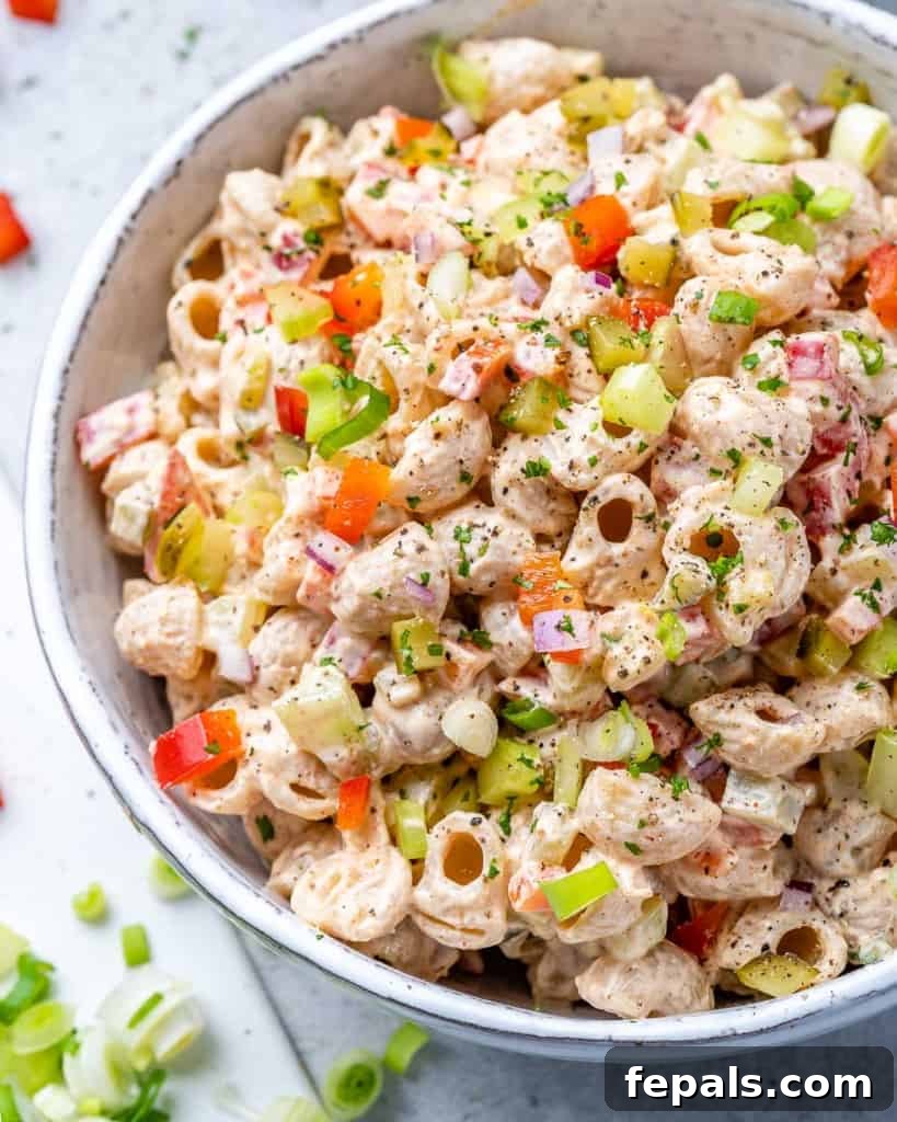 Grandma's Simple Macaroni Salad 9 close up view of macaroni salad in a white bowl, showing individual pasta and vegetable pieces