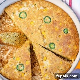 skillet cornbread with 3 slices cut off