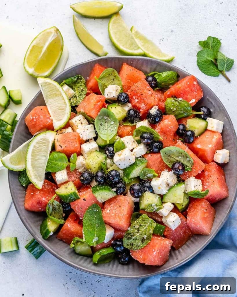 Vibrant Watermelon Feta Salad 8 A stunning shot of watermelon feta salad in a bowl, highlighted by natural light, showing off its fresh ingredients and inviting colors.