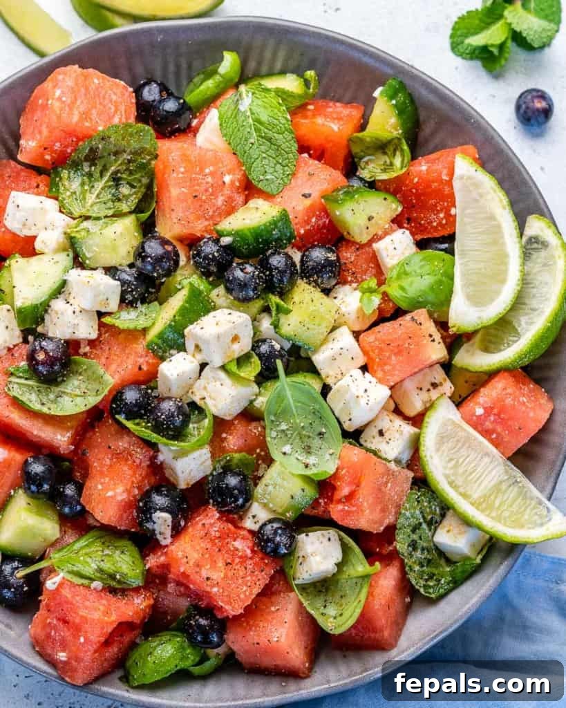 Vibrant Watermelon Feta Salad 9 Full bowl of watermelon feta salad presented beautifully, with a focus on its inviting freshness and summery colors.