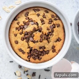 Top view of baked oats in a white mug