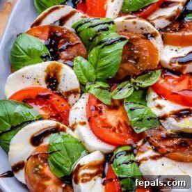 Close image of Caprese salad on plate with balsamic drizzle