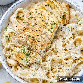 top view chicken alfredo in a white bowl