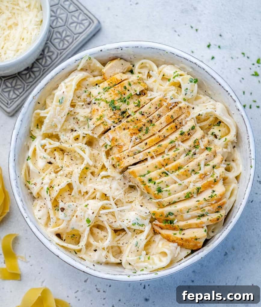 Creamy Chicken Fettuccine Bliss 7 top view alfredo topped with sliced chicken