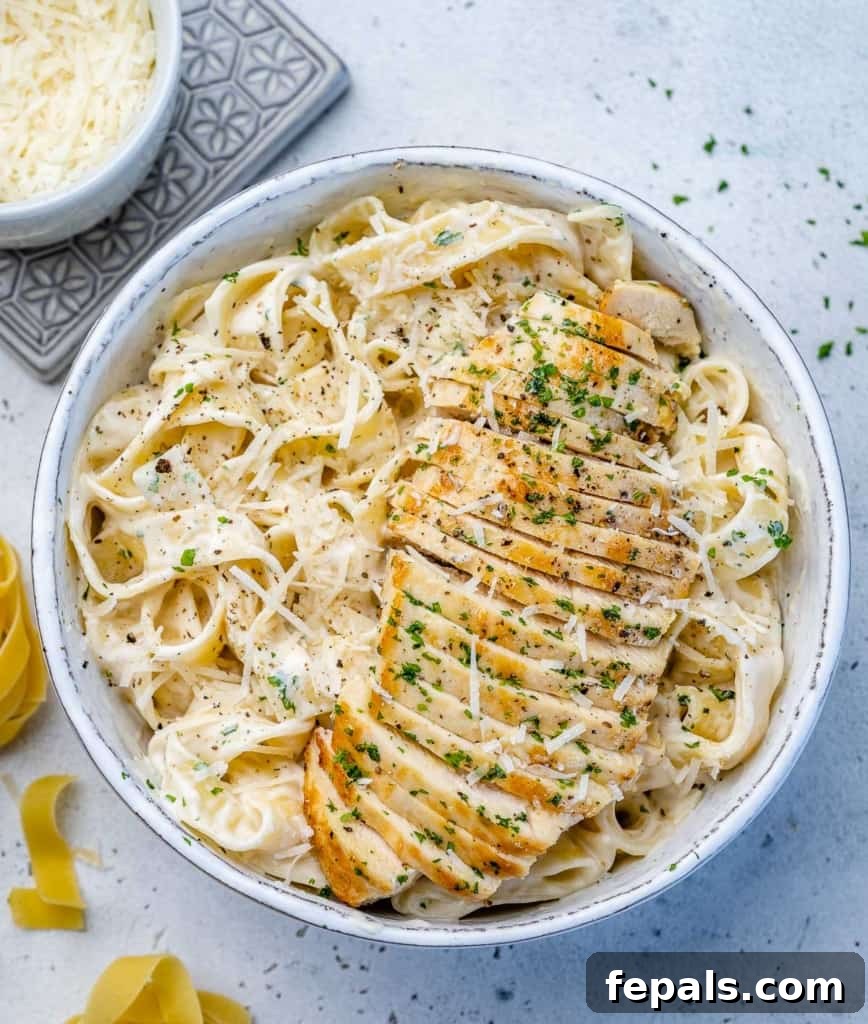 Creamy Chicken Fettuccine Bliss 9 top view chicken alfredo in a white bowl