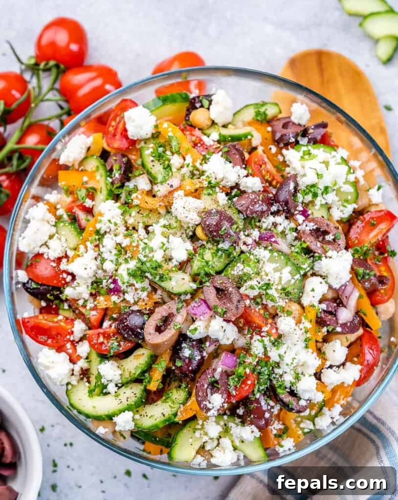 Zesty Greek Garbanzo Medley 2 top view greek style chickpea salad in a clear bowl