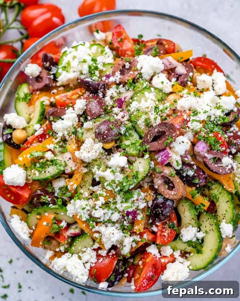 Zesty Greek Garbanzo Medley 7 top view veggies salad with chickpea in a clear bowl