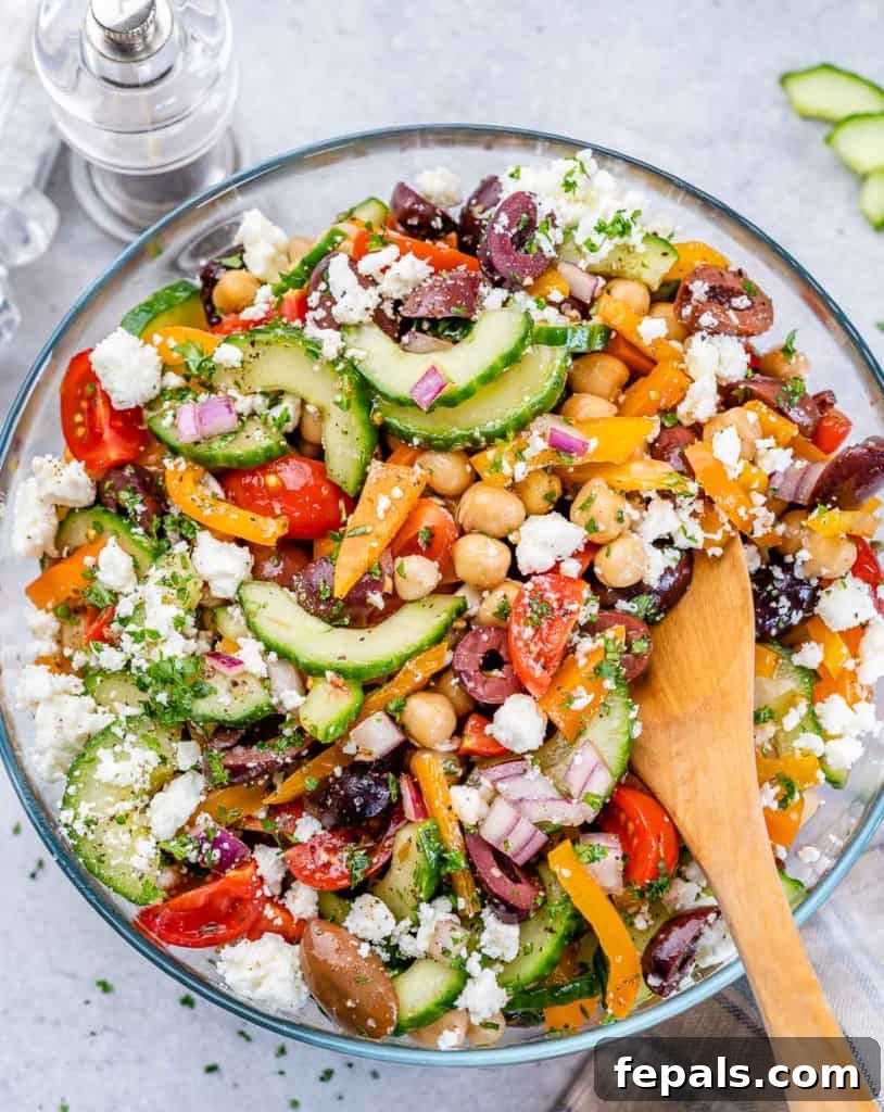 Zesty Greek Garbanzo Medley 8 top view wooden spoon in chickpea salad bowl