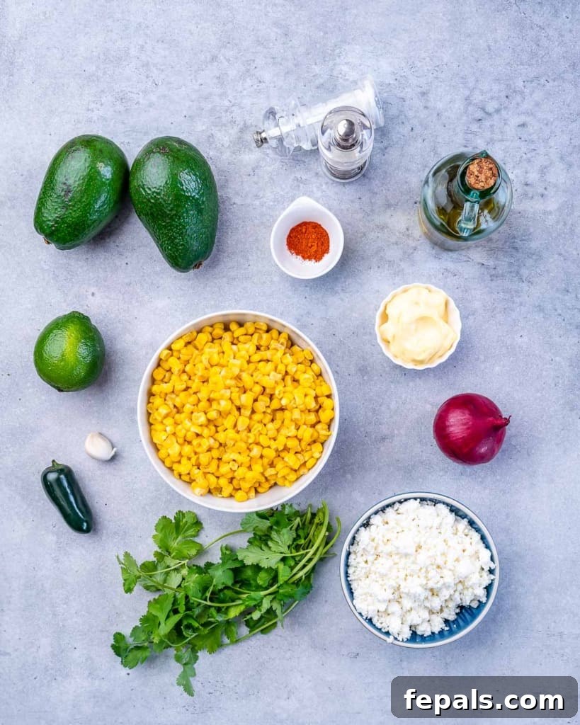 Zesty Fiesta Corn Salad 3 Close-up of fresh corn on the cob and other salad ingredients laid out, showcasing the vibrant colors.