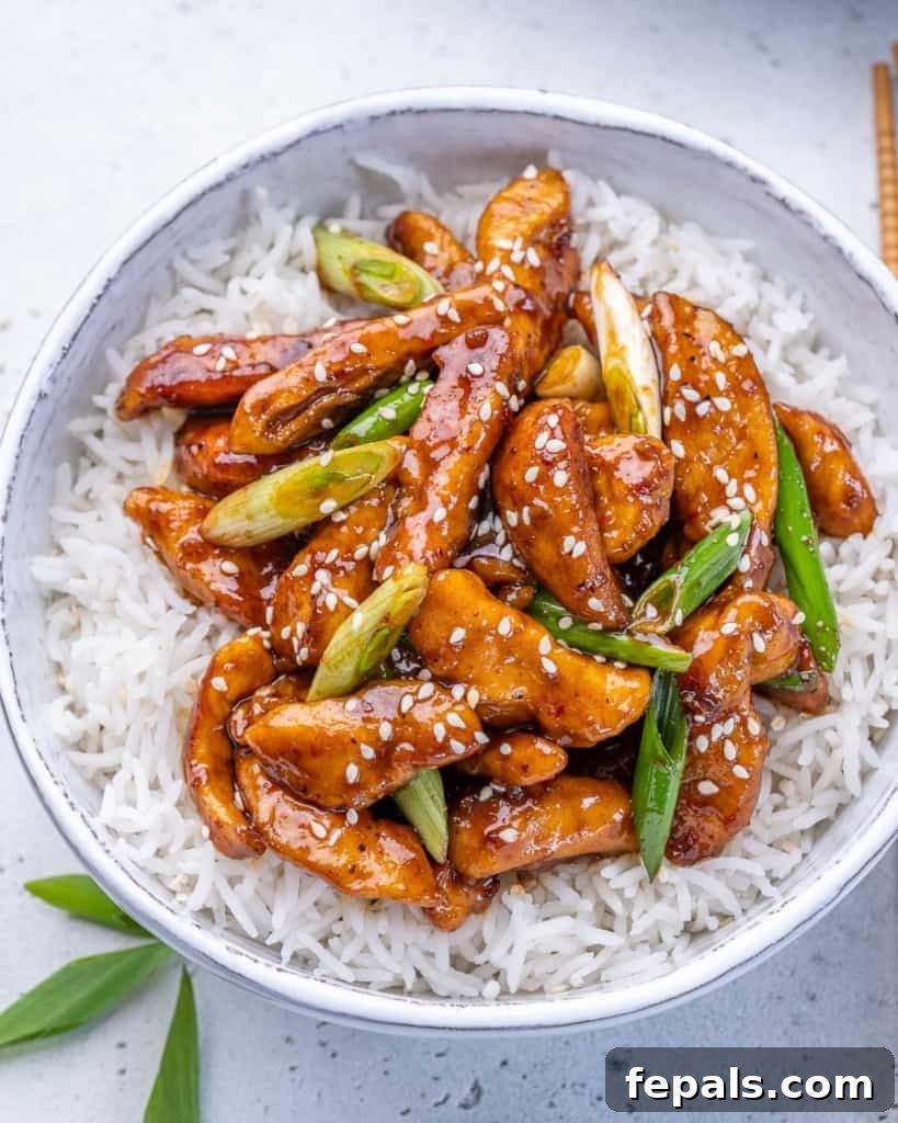 Sticky Garlic Mongolian Chicken 2 close up top view of mongolian chicken serve over a bowl of rice