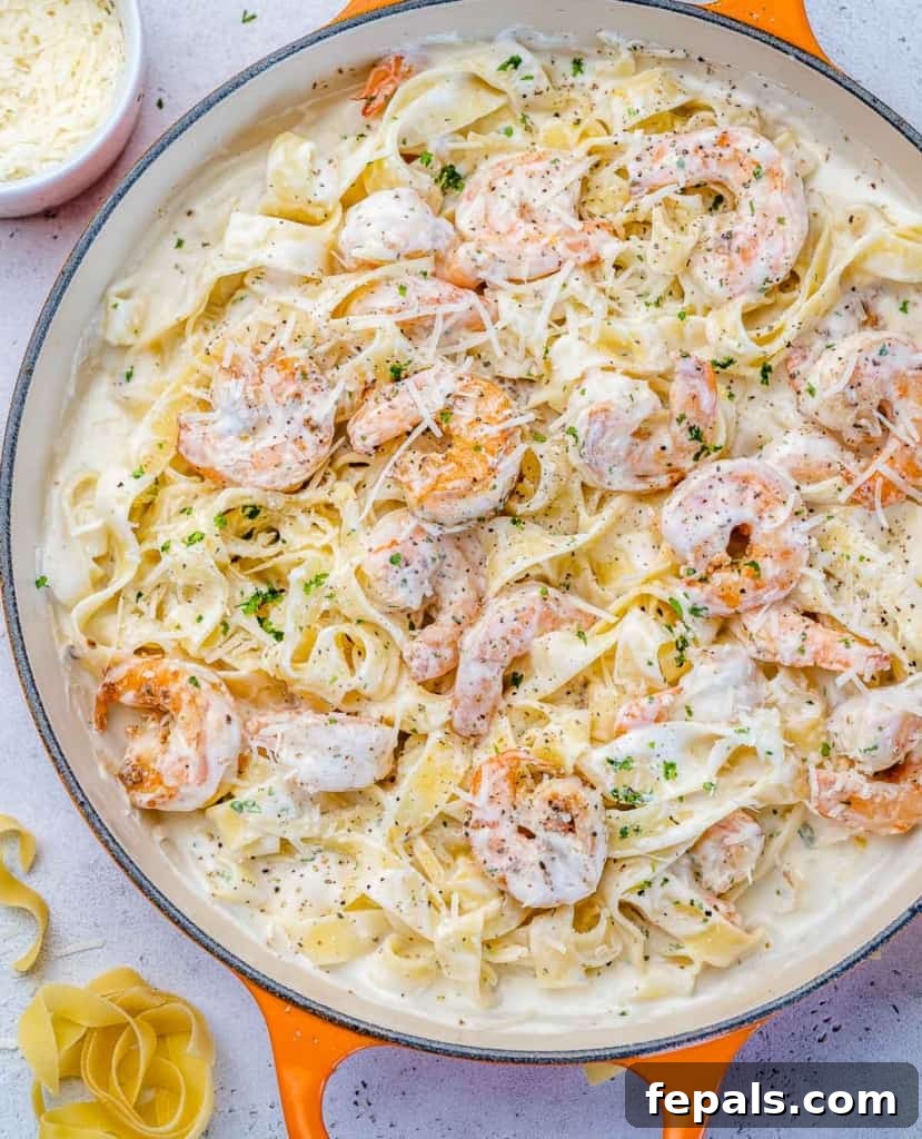 top view creamy shrimp alfredo in a pan