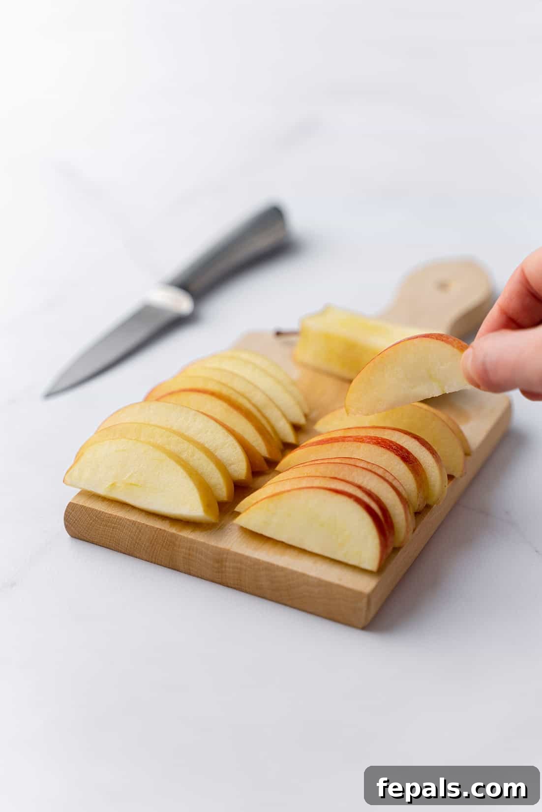 How to Cut an Apple for Snacks and Meals apple slices on cutting board, showcasing perfectly cut pieces ready for consumption