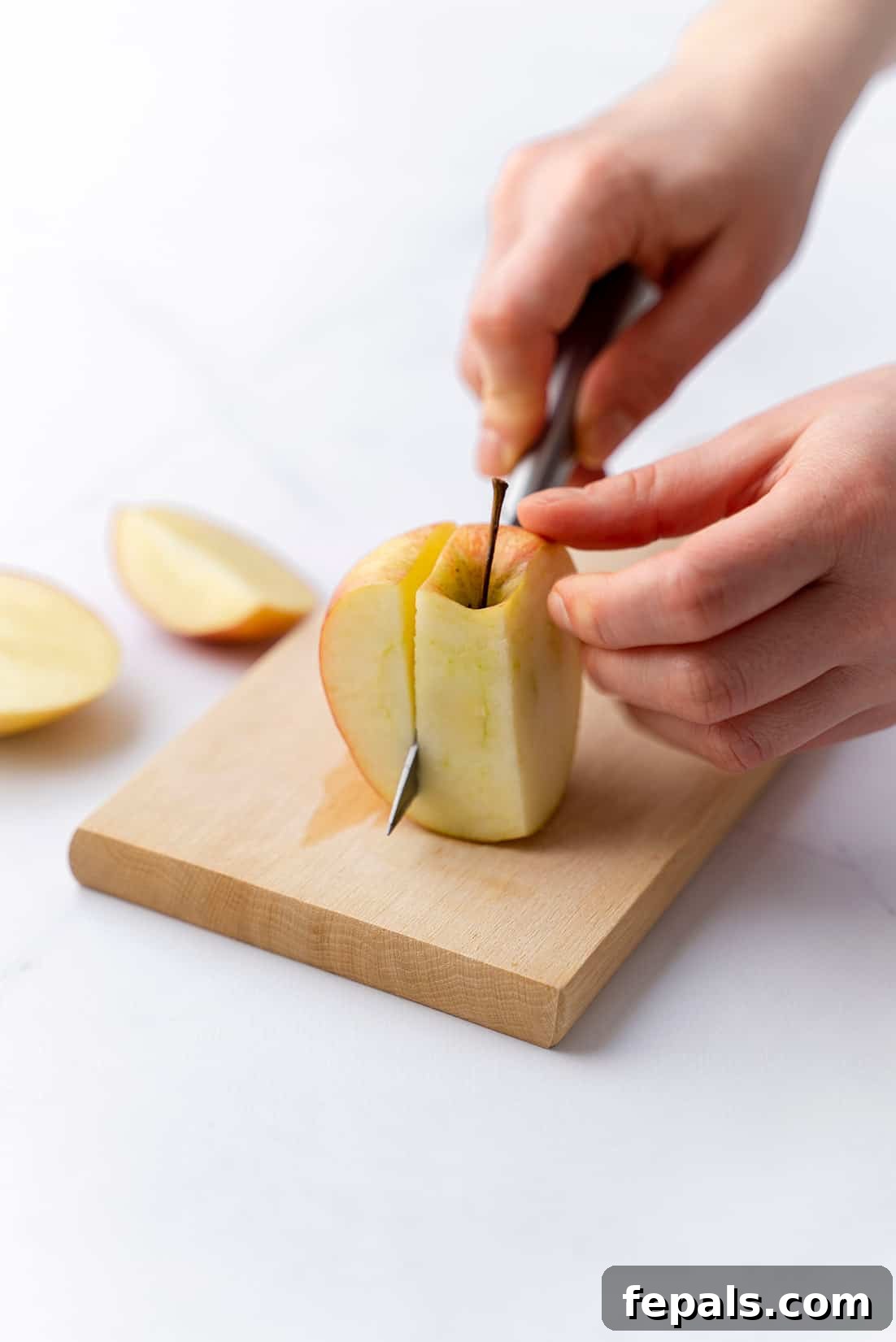 Mastering Apple Slicing slicing and coring an apple with a knife on cutting board, demonstrating precision and technique