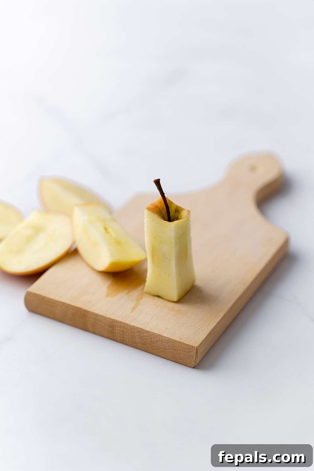 Clean Apple Core Removal one apple core on cutting board, showing the result of proper coring